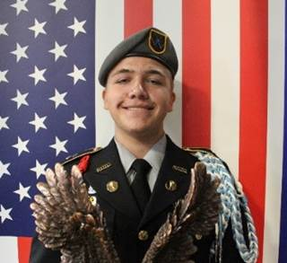 A person in military uniform holding an eagle